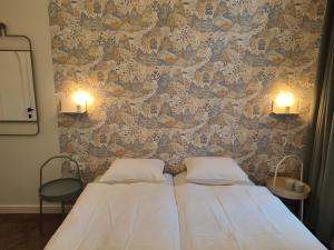 A bed or beds in a room at Studio Anvers