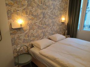 A bed or beds in a room at Studio Anvers