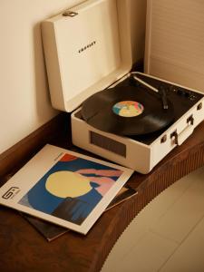 a record player sitting on a table next to a record player at No 42 by GuestHouse, Margate in Margate