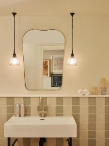 a bathroom with a sink and a mirror at No 42 by GuestHouse, Margate in Margate