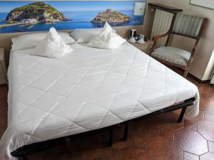 Postel nebo postele na pokoji v ubytování Hotel Montecarlo