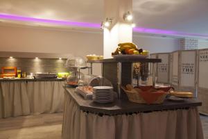 a table with a bunch of food on it at Hotel Kiez Pension Berlin in Berlin