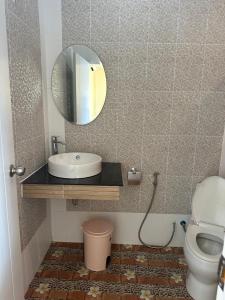a bathroom with a sink and a mirror at Love Koh Tao Villa in Koh Tao