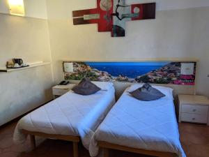 Postel nebo postele na pokoji v ubytování Hotel Montecarlo