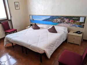 Postel nebo postele na pokoji v ubytování Hotel Montecarlo