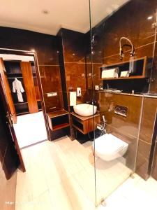 a bathroom with two sinks and a shower at RONTA WORLD HOTELS in Chandīgarh