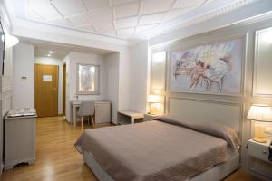 Postel nebo postele na pokoji v ubytování Byzantino Hotel