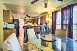 a kitchen with a table and chairs in a room at Alexandria Area Vacation Rental with Backyard in Accokeek