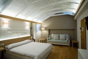 Postel nebo postele na pokoji v ubytování Byzantino Hotel