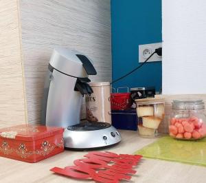 a blender sitting on top of a counter with food at Le Canut Duviard - proche métro Croix-Rousse in Lyon