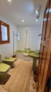 a bathroom with a green sink and a toilet at Casa Playa Javea in Jávea +29 photos