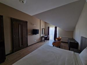 En eller flere senger på et rom på Aleksandrović Guest House