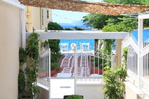 a view from the balcony of a house at Asteri Apartments Mytikas 2-Bedroom Seaview Courtyard in Mitika