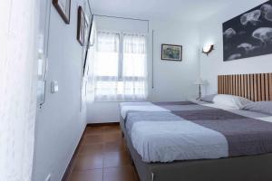 Posteľ alebo postele v izbe v ubytovaní PRIMERISIMA LINEA DE MAR. HUTG 038644-53