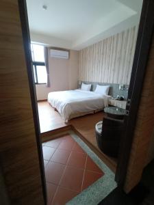 Posteľ alebo postele v izbe v ubytovaní Fu Yu Spring House