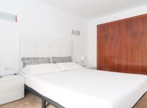 Postel nebo postele na pokoji v ubytování Picasso Suites