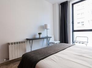 Postel nebo postele na pokoji v ubytování Picasso Suites