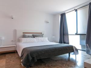 Postel nebo postele na pokoji v ubytování Picasso Suites