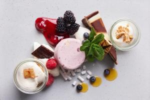 a group of desserts with fruit and ice cream at Van der Valk Cuijk - Nijmegen in Nijmegen