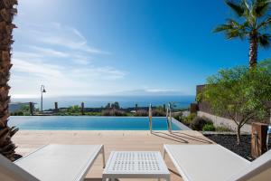 a view of a swimming pool from a house at Los Jardines de Abama Suites in Guía de Isora
