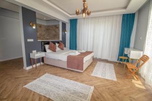 Postel nebo postele na pokoji v ubytování Kayapark 4+1 Villa, Özel Havuzlu, Fethiye + 20 fotografií