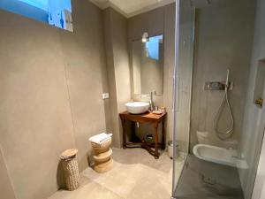 a bathroom with a sink and a shower at La Motta in Belgirate