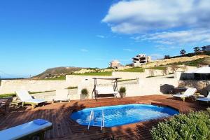 The swimming pool at or close to Pamela's house "private pool and spa"