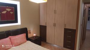 A bed or beds in a room at Theodora's home