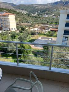 a balcony with a view of a city at Hotel Prinos in Himare