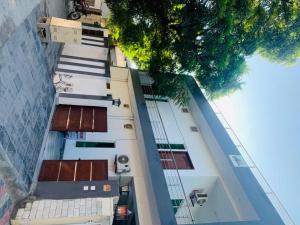 an overhead view of a building with a tree at Star light in Islamabad