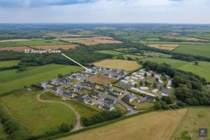 an aerial view of a cluster of houses in a field at Quality rural retreat in Roch