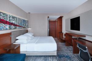 a hotel room with a bed and a flat screen tv at Delta Hotels by Marriott Istanbul Levent in Istanbul