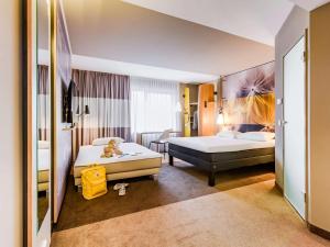 Postel nebo postele na pokoji v ubytování ibis Luebeck City