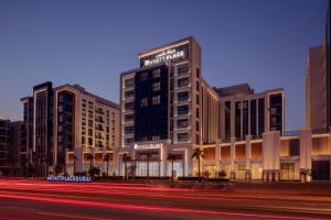 a view of a building with a street in front of it at Hyatt Place Dubai Jumeirah in Dubai
