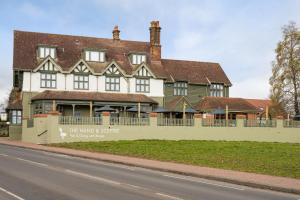 a large house on the side of a road at The Hand & Sceptre by Innkeeper's Collection in Southborough