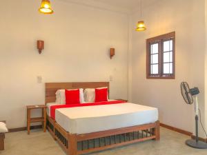 Ένα ή περισσότερα κρεβάτια σε δωμάτιο στο Mango House Unawatuna