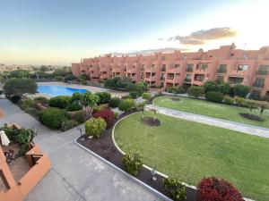 an aerial view of an apartment complex with a swimming pool at Tejita Sun beach Holidays By Deihu Experiences in El Médano