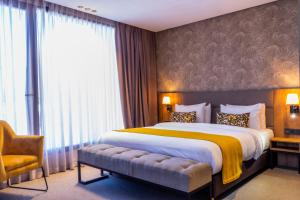 Postel nebo postele na pokoji v ubytování Urban Hotel & Spa