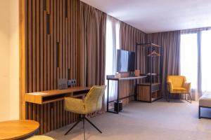 TV a/nebo společenská místnost v ubytování Urban Hotel & Spa