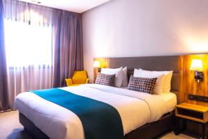 Postel nebo postele na pokoji v ubytování Urban Hotel & Spa