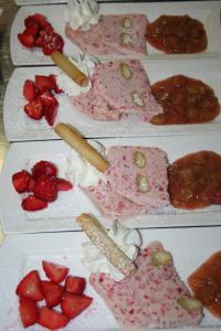a group of plates of food with strawberries on them at Landgasthof Mücke in Marsberg