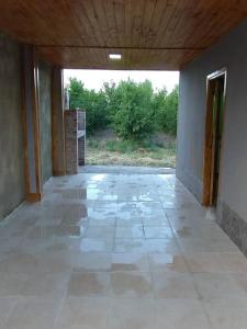 an empty hallway of a house with a large window at Departamento El Renuevo in Vista Flores