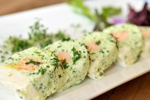 a plate of food with cheese and dill at Landgasthof Mücke in Marsberg