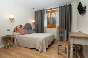 TV a/nebo společenská místnost v ubytování Hotel de Montaña El Mirador
