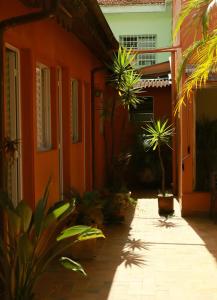 an orange house with plants in front of it at Pousada Ibituruna - Aeroporto de Congonhas in Sao Paulo