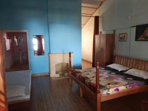 Voodi või voodid majutusasutuse Leela Cottages toas