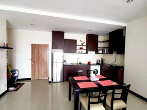 a kitchen and dining room with a table and chairs at Апартаменты с видом на море на Карон Бич А 509 in Karon Beach