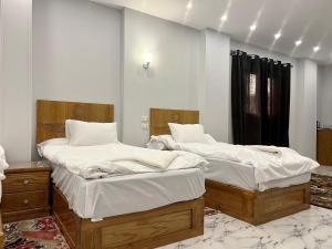 Postel nebo postele na pokoji v ubytování Life Pyramids Inn