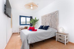 Postel nebo postele na pokoji v ubytování Home2Book Aloha Palm + 29 fotografií