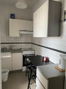Kuchyň nebo kuchyňský kout v ubytování Apartment M & M